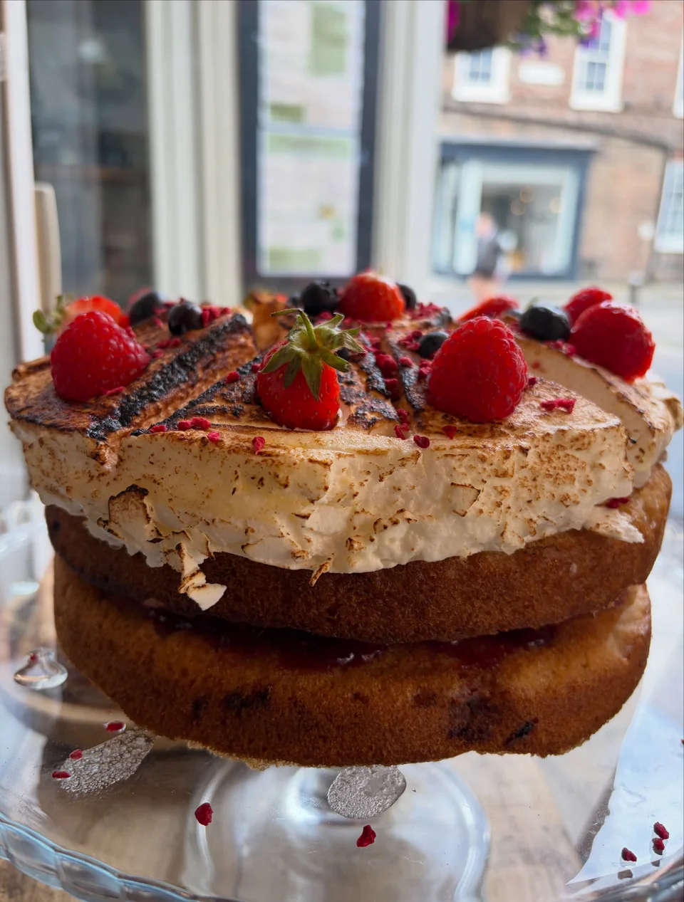 A berry-topped homemade cake in the Wheldrakes window